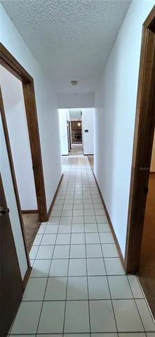 a view of a livingroom with an empty space and a fireplace