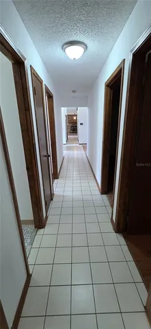 a view of a hallway view with staircase