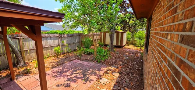 a backyard of a house with lots of green space