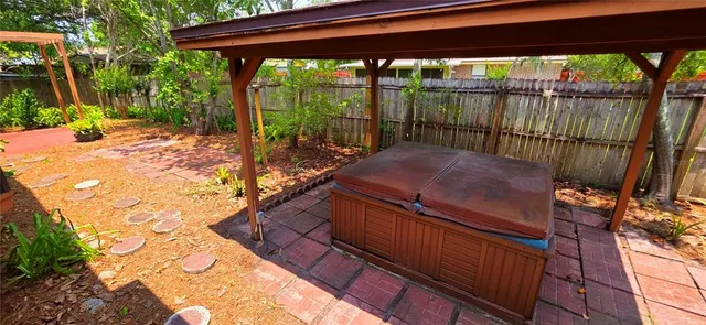 a view of a backyard with sitting area