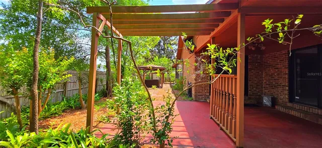 a view of a potted flower in the corridor