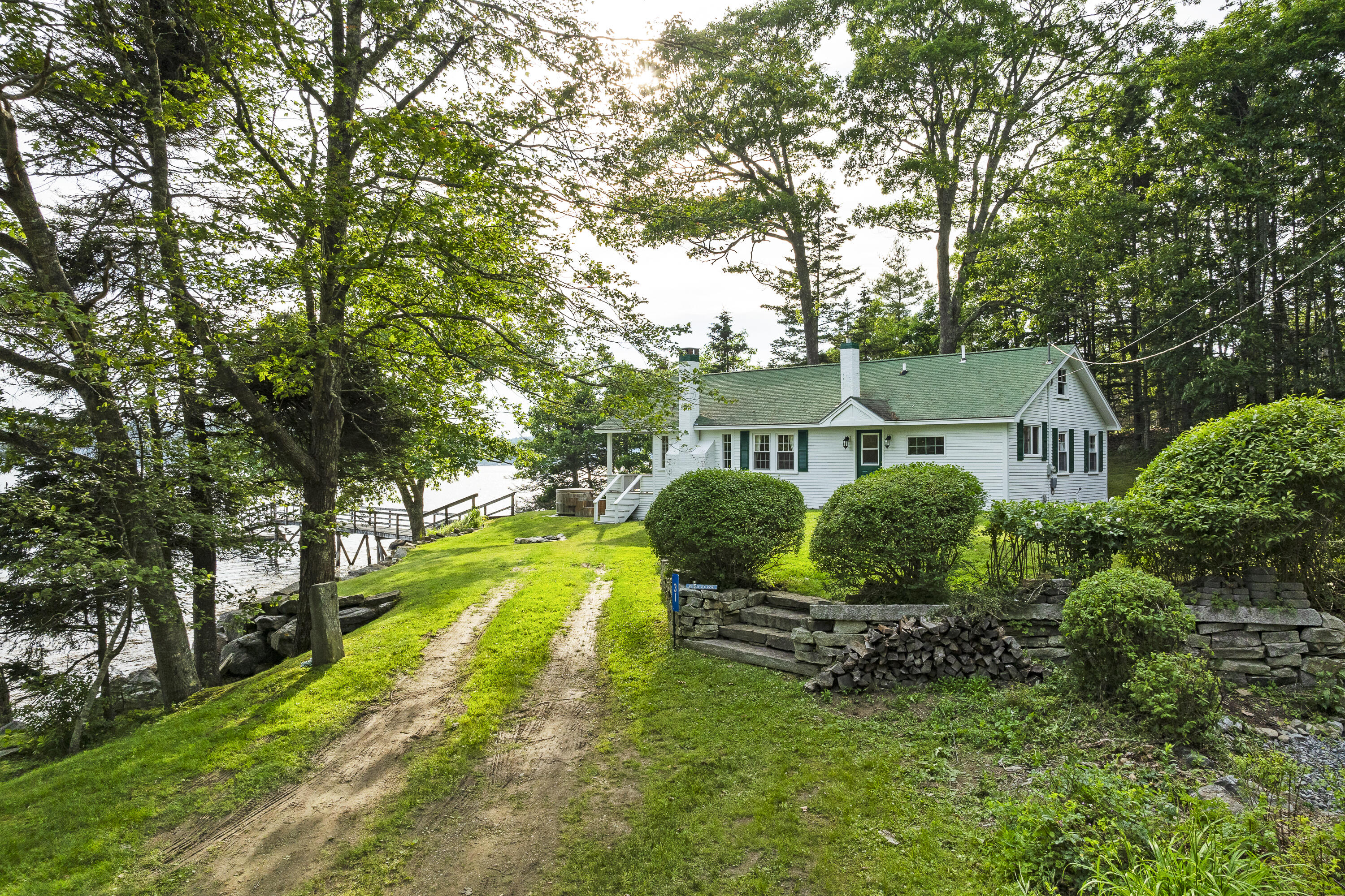 28-31 Will Alley Road South Bristol, ME 04568 - Photo 2 of 67 Rock wall borders lawn