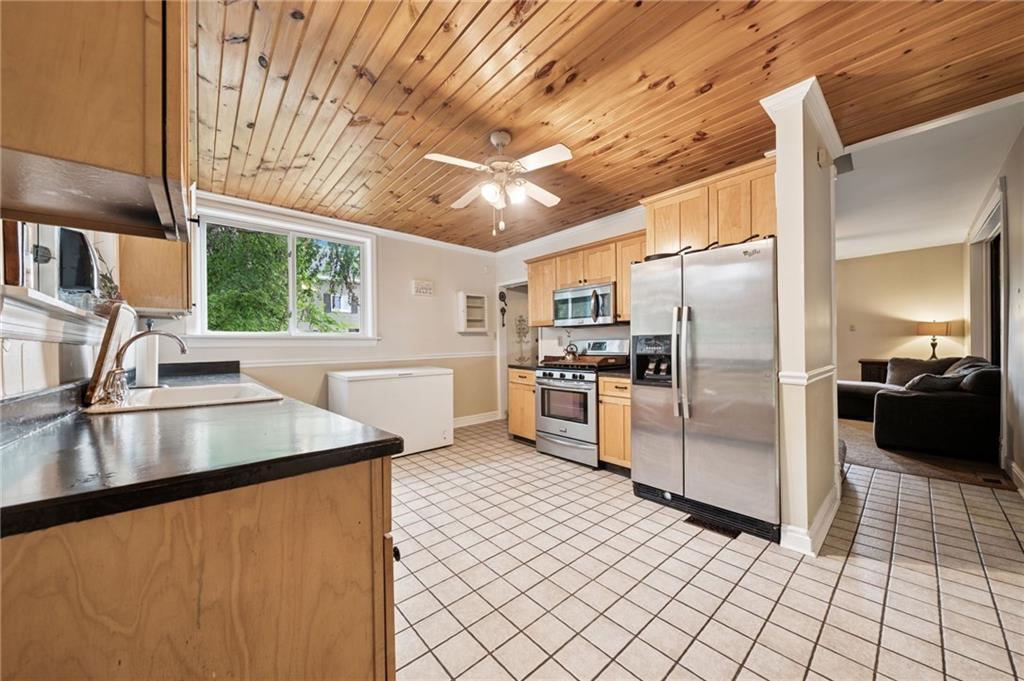 1035 Linden Road Eighty Four, PA 15330 - Photo 15 of 29 a kitchen with stainless steel appliances granite countertop a refrigerator a stove and a sink with cabinets
