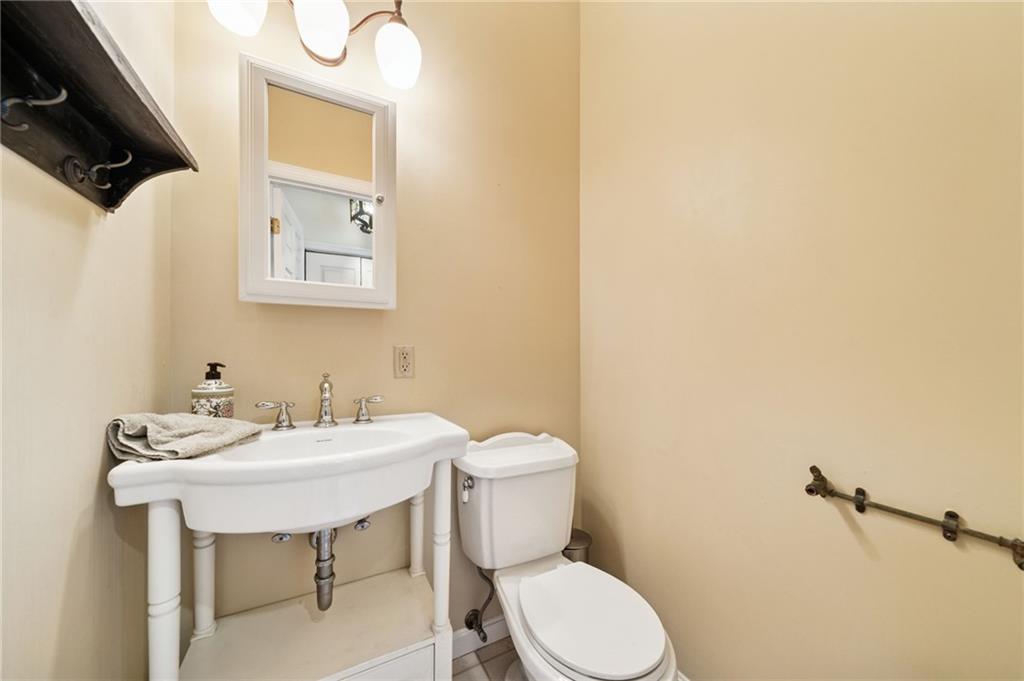 1035 Linden Road Eighty Four, PA 15330 - Photo 20 of 29 a bathroom with a sink a toilet and mirror