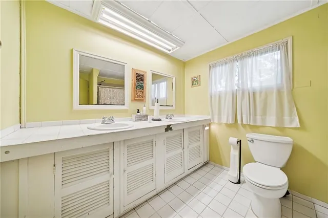 a bedroom with bed and a window