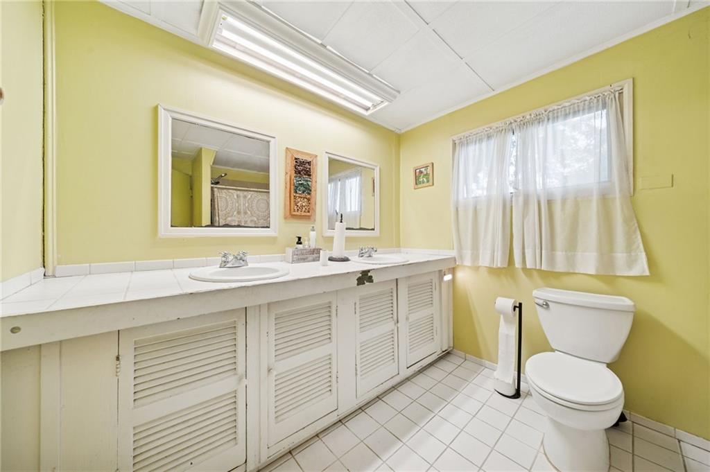 1035 Linden Road Eighty Four, PA 15330 - Photo 25 of 29 a bathroom with a granite countertop toilet sink and mirror