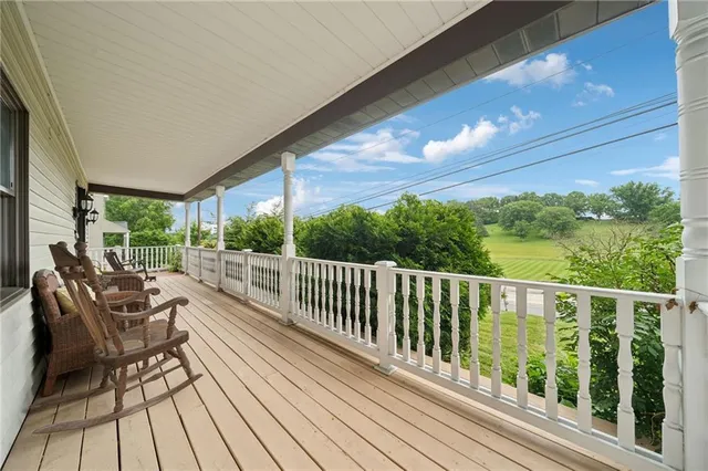 a view of balcony with furniture
