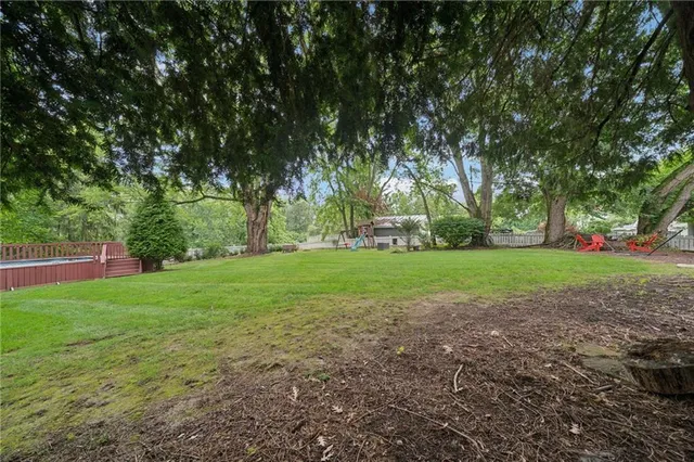 a view of a park with large trees