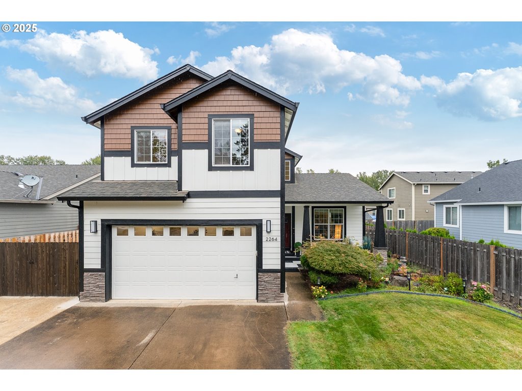 2264 Equestrian Loop South Salem, OR 97302 - Photo 1 of 34 a view of a house with a yard and plants