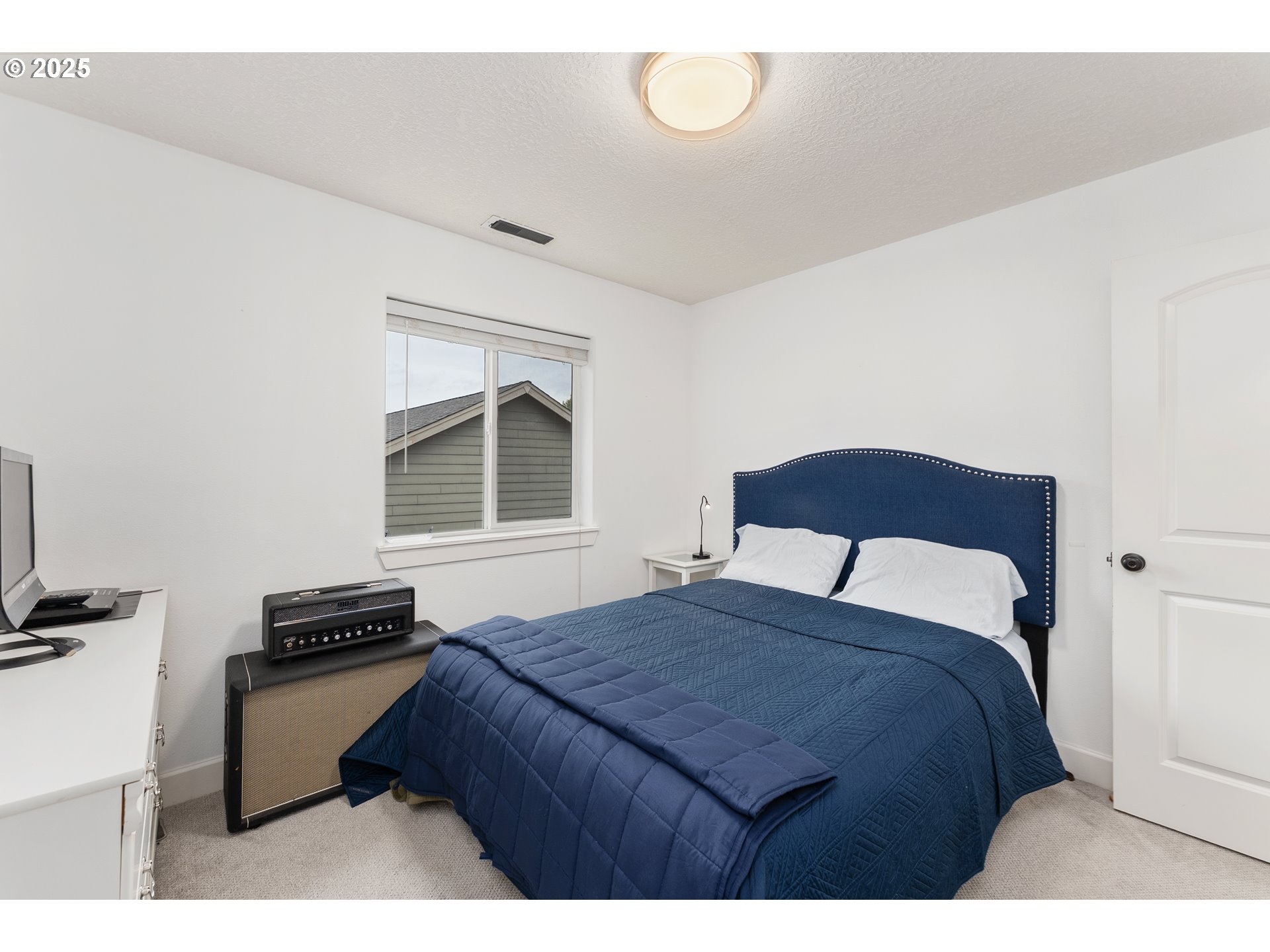 2264 Equestrian Loop South Salem, OR 97302 - Photo 27 of 34 a bedroom with a bed and a window