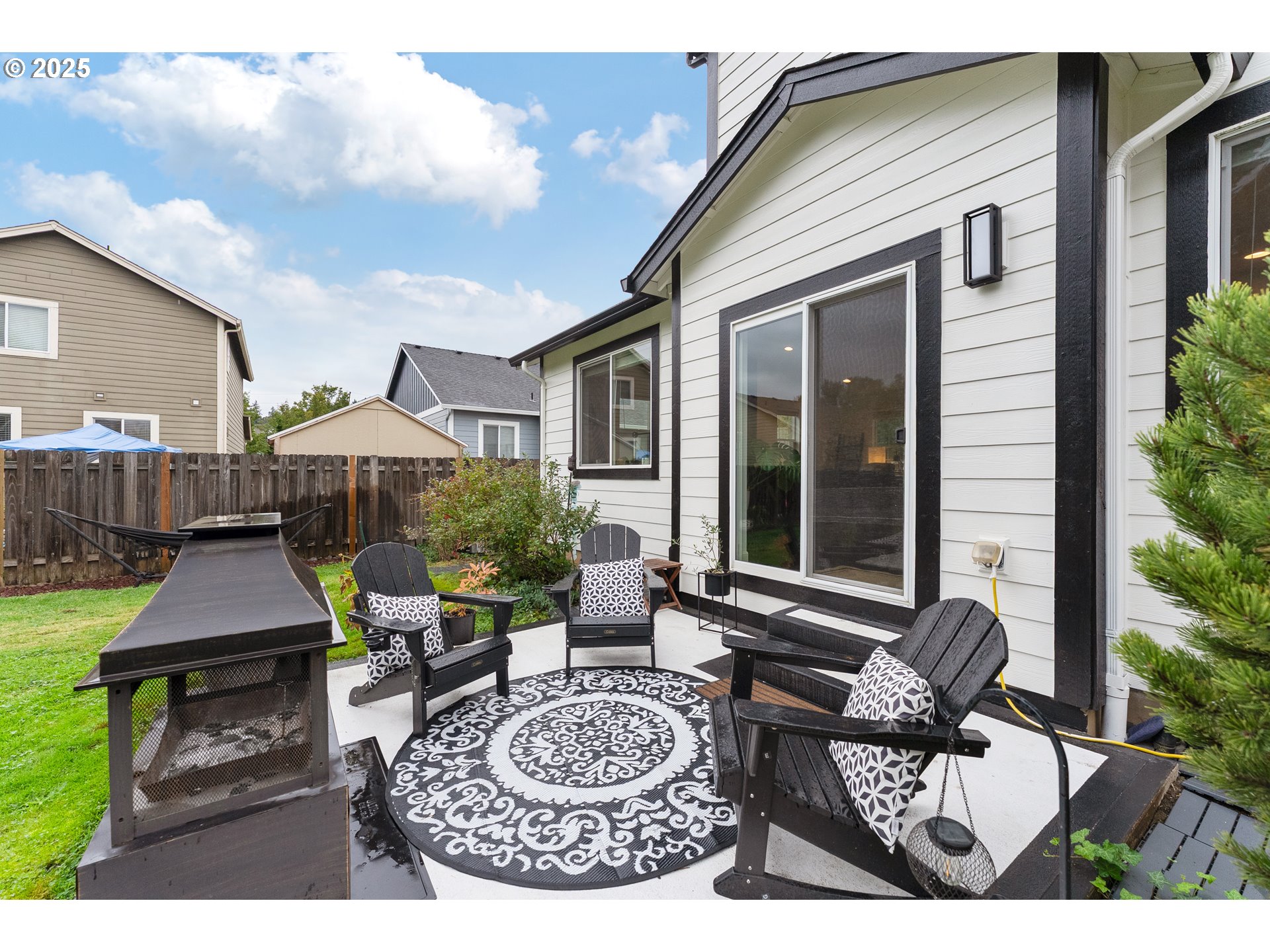 2264 Equestrian Loop South Salem, OR 97302 - Photo 30 of 34 a view of a patio with couches table and chairs and potted plants