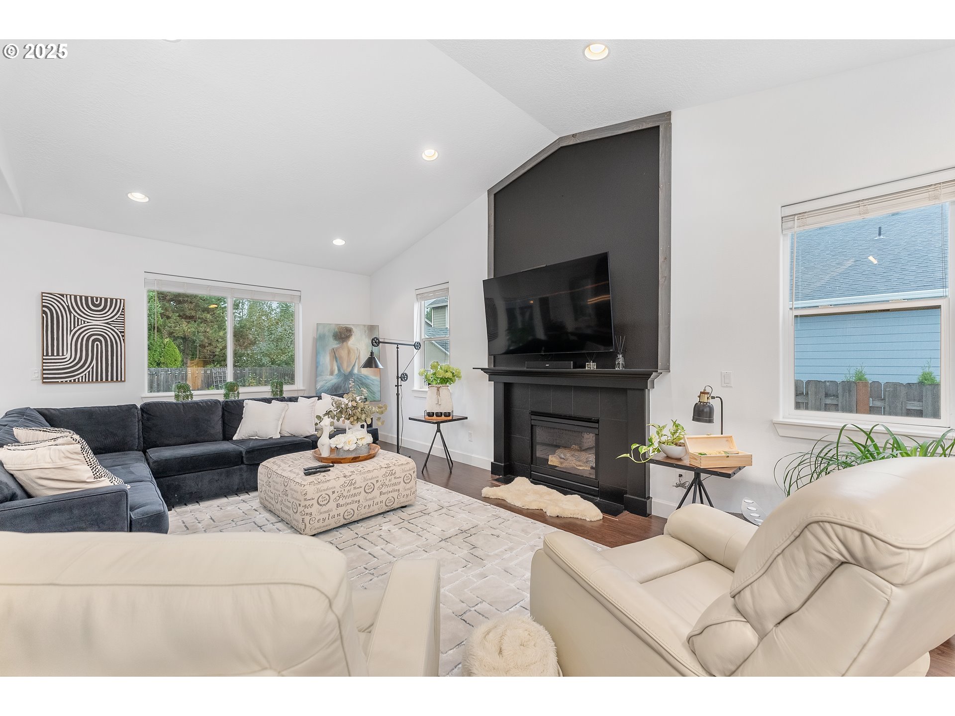 2264 Equestrian Loop South Salem, OR 97302 - Photo 5 of 34 a living room with furniture a fireplace and a flat screen tv
