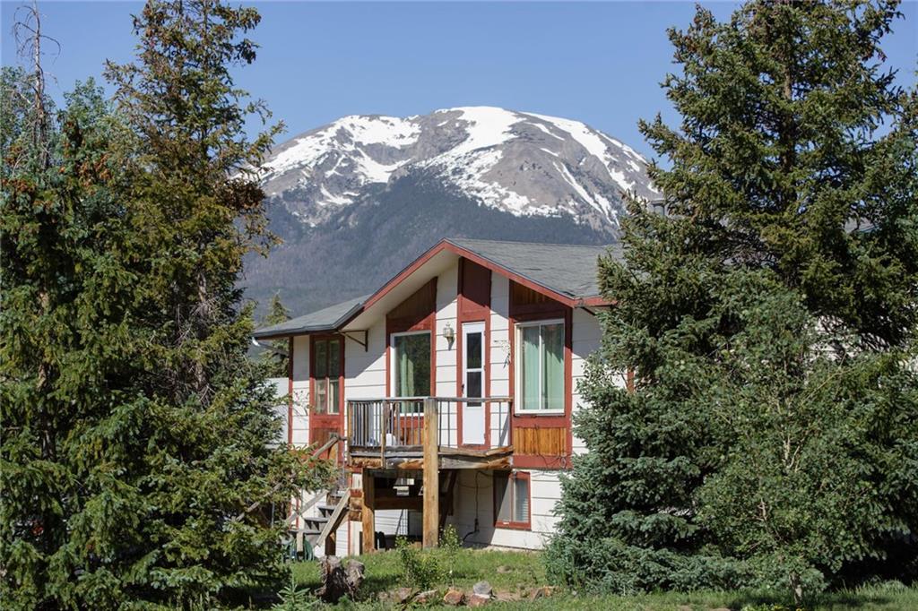 151 Alpine Road Dillon, CO 80435 - Photo 2 of 30 a front view of a house with yard and trees around