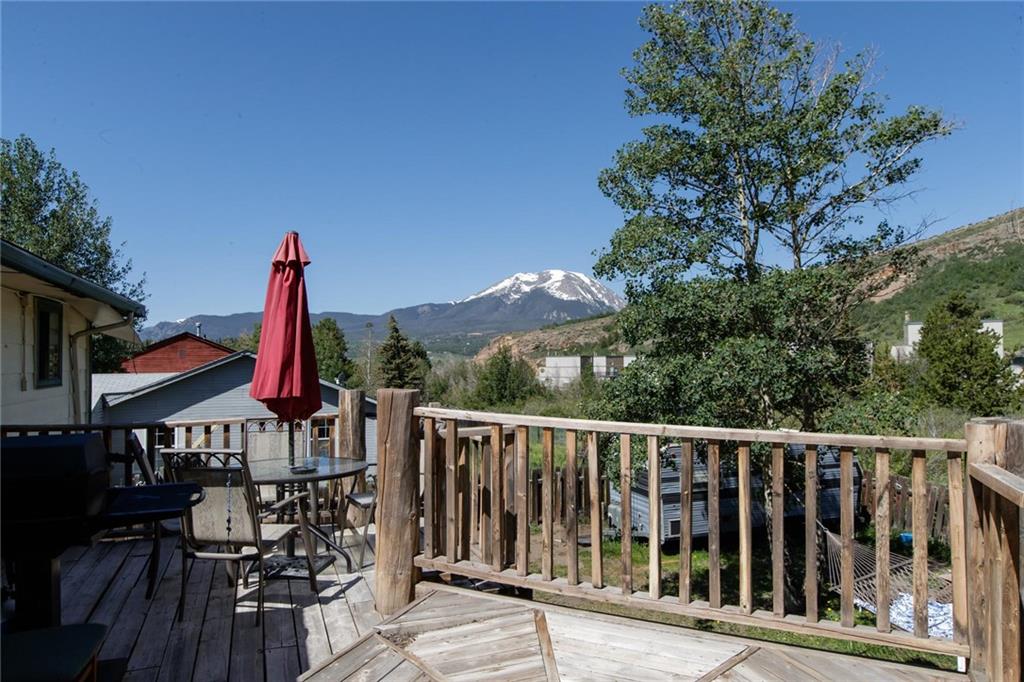 151 Alpine Road Dillon, CO 80435 - Photo 20 of 30 a view of balcony with wooden floor and outdoor seating