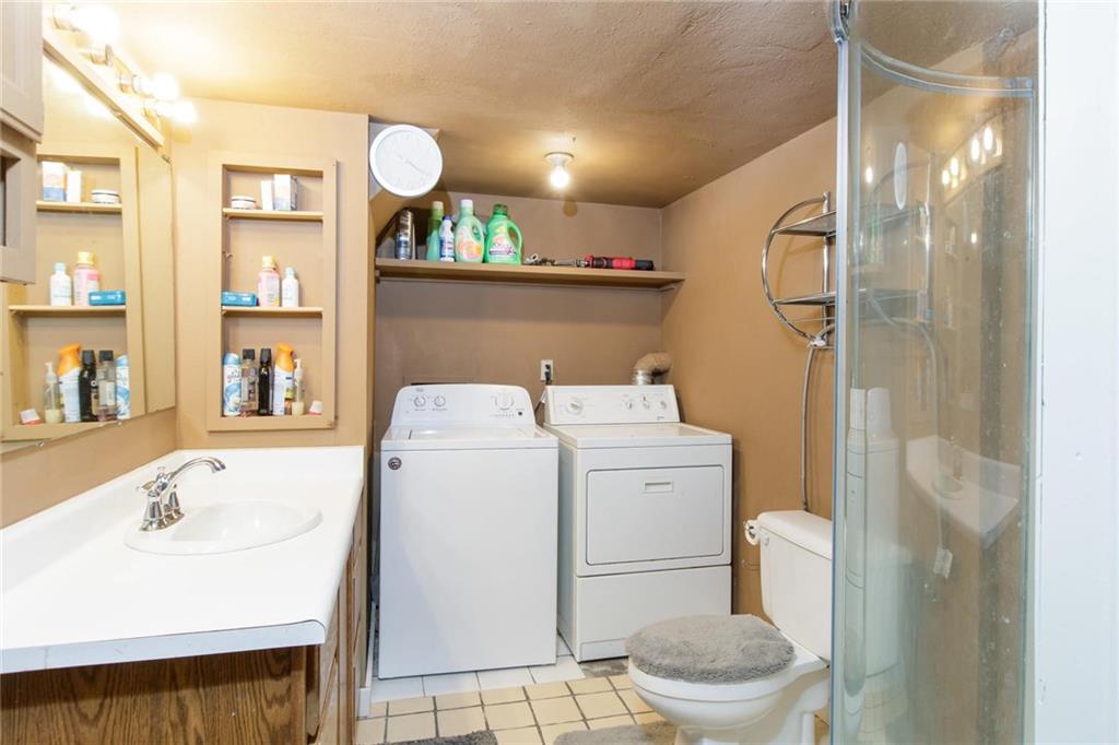 151 Alpine Road Dillon, CO 80435 - Photo 27 of 30 a bathroom with a sink a toilet and a mirror