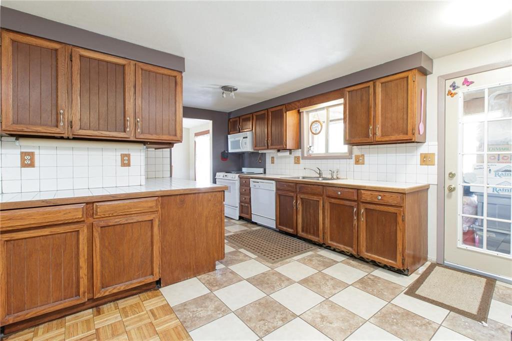 151 Alpine Road Dillon, CO 80435 - Photo 9 of 30 a kitchen with stainless steel appliances granite countertop a stove a sink and a microwave