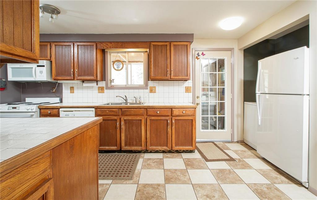 151 Alpine Road Dillon, CO 80435 - Photo 10 of 30 a kitchen with a stove a sink and a refrigerator