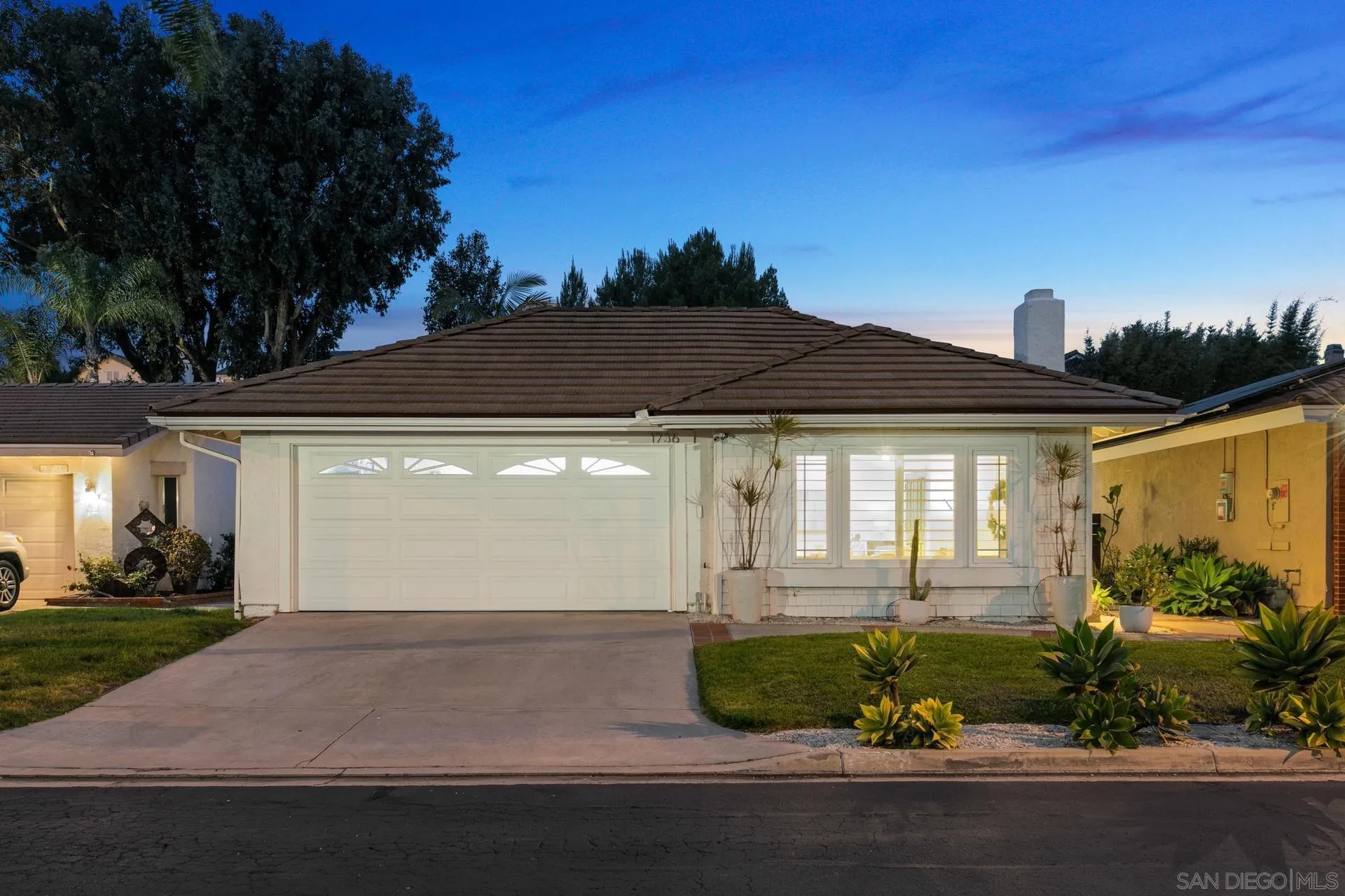 1736 Hill Top Lane Encinitas, CA 92024 - Photo 2 of 63 a front view of a house with garden