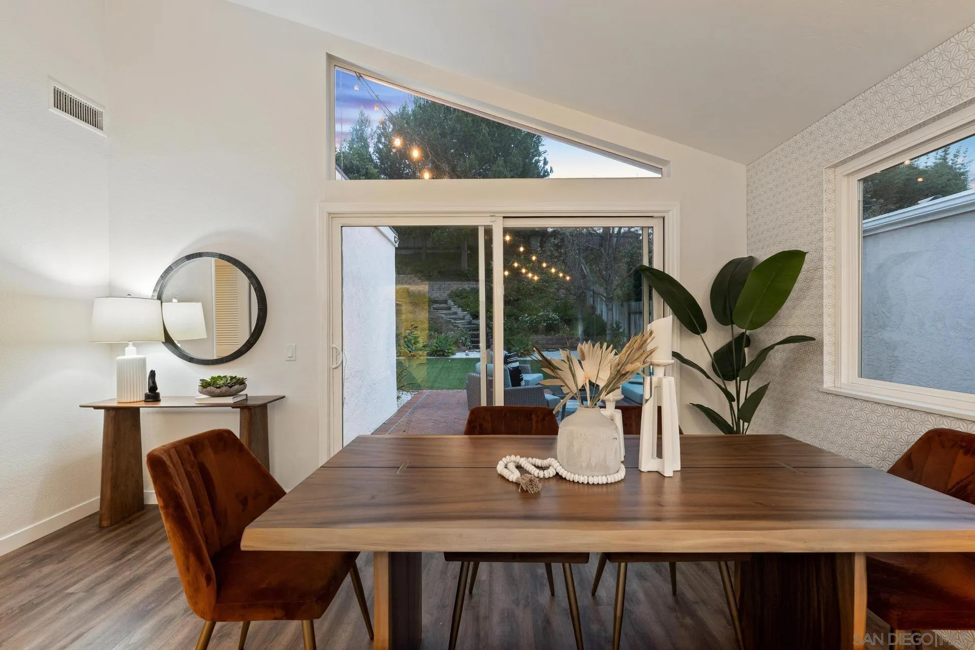 1736 Hill Top Lane Encinitas, CA 92024 - Photo 28 of 63 a view of a dining room with furniture window and wooden floor