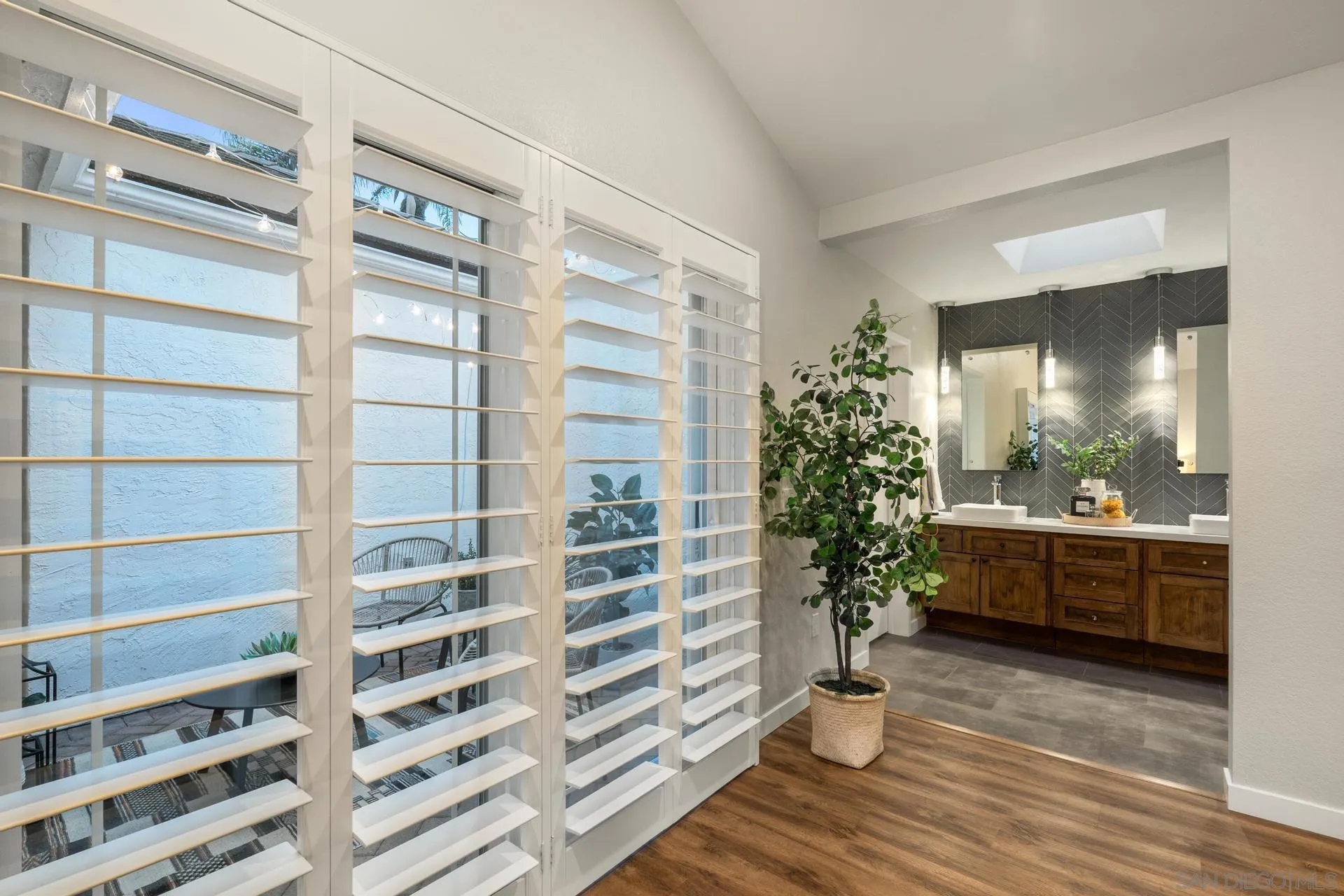 1736 Hill Top Lane Encinitas, CA 92024 - Photo 33 of 63 a view of a room with a potted plant and floor to ceiling window