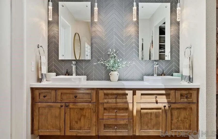 1736 Hill Top Lane Encinitas, CA 92024 - Photo 35 of 63 a bathroom with a sink and a mirror