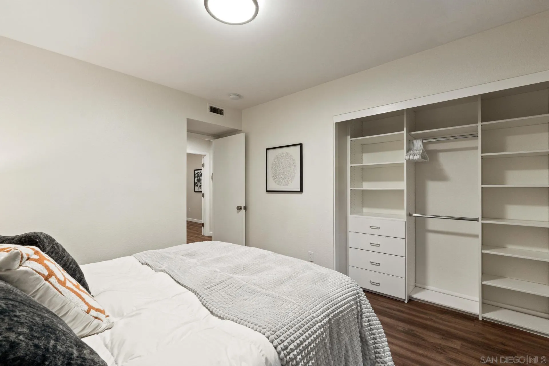 1736 Hill Top Lane Encinitas, CA 92024 - Photo 38 of 63 a bedroom with a bed and a cabinets