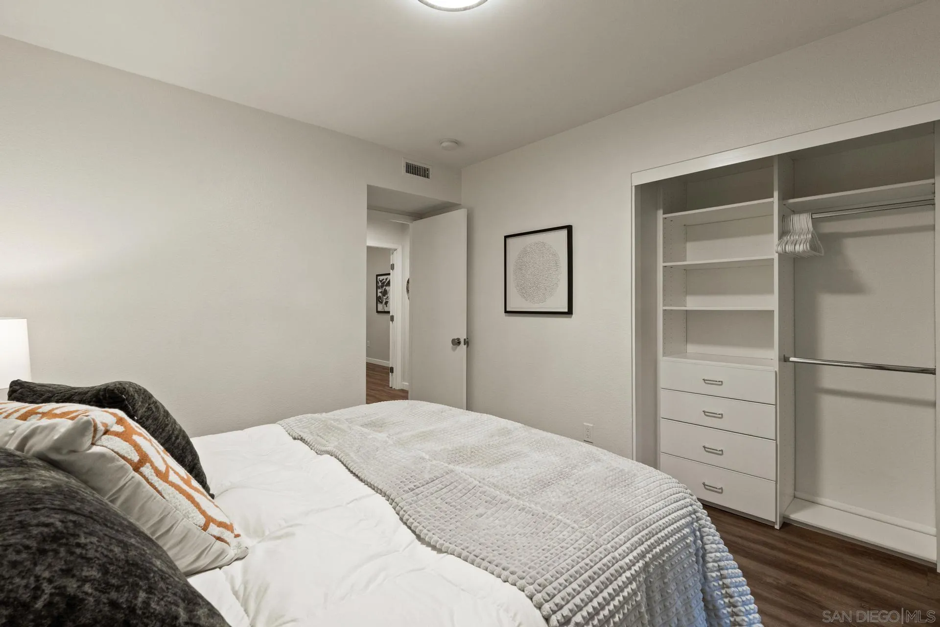 1736 Hill Top Lane Encinitas, CA 92024 - Photo 39 of 63 a bedroom with a bed and a closet