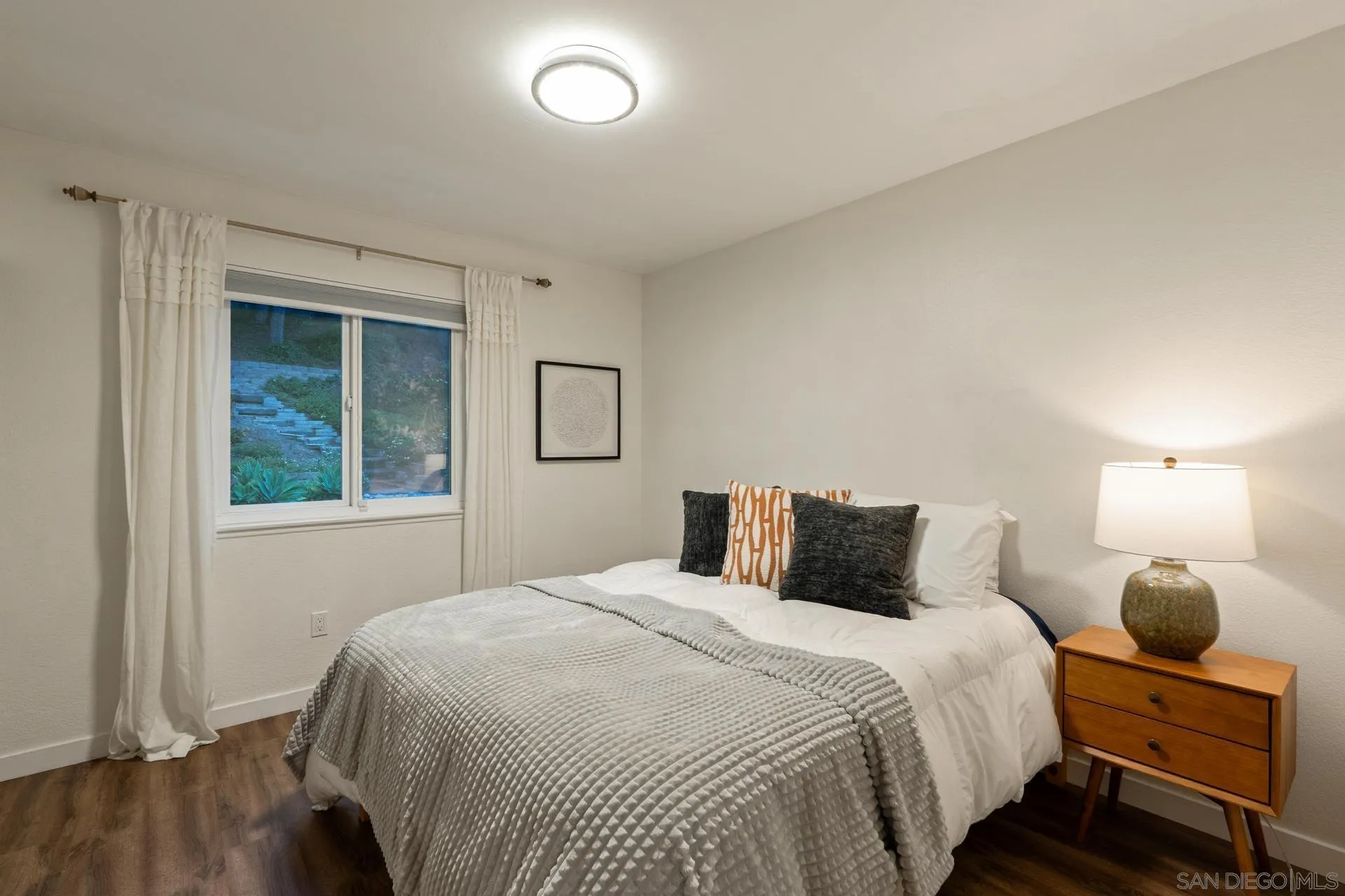 1736 Hill Top Lane Encinitas, CA 92024 - Photo 40 of 63 a bedroom with a bed and window