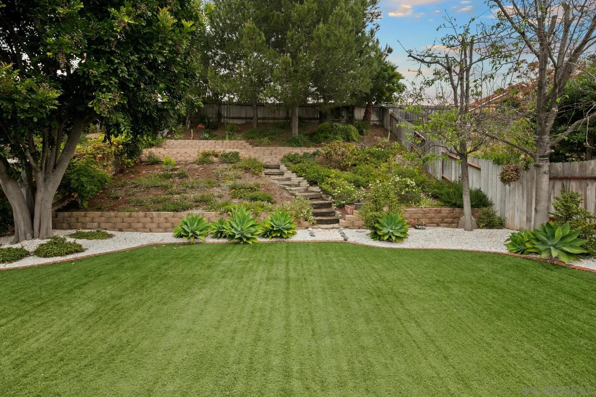 1736 Hill Top Lane Encinitas, CA 92024 - Photo 55 of 63 a view of a backyard with large trees