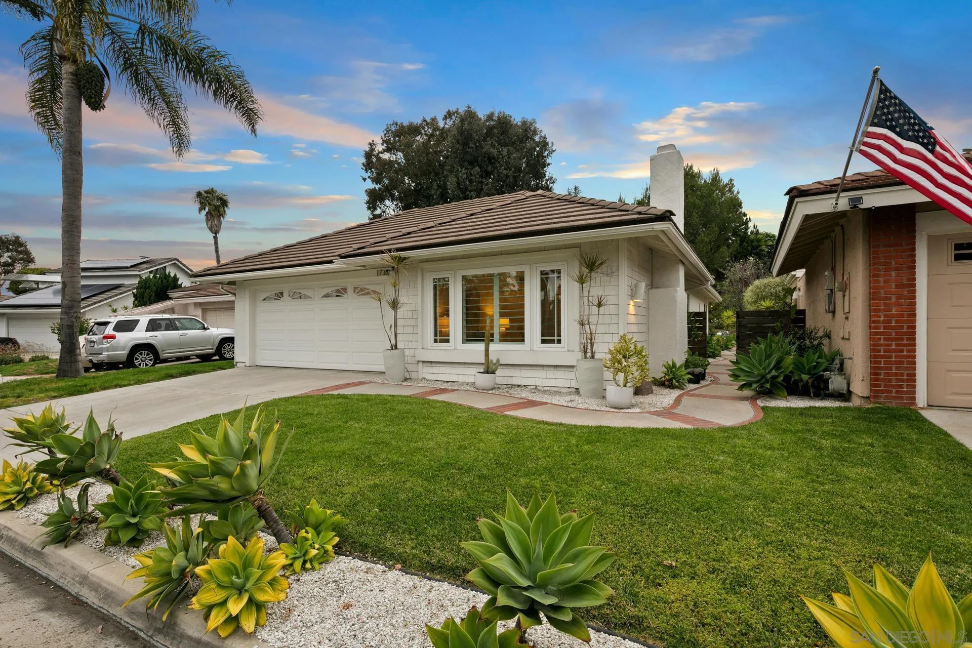 1736 Hill Top Lane Encinitas, CA 92024 - Photo 60 of 63 a front view of a house with swimming pool having outdoor seating
