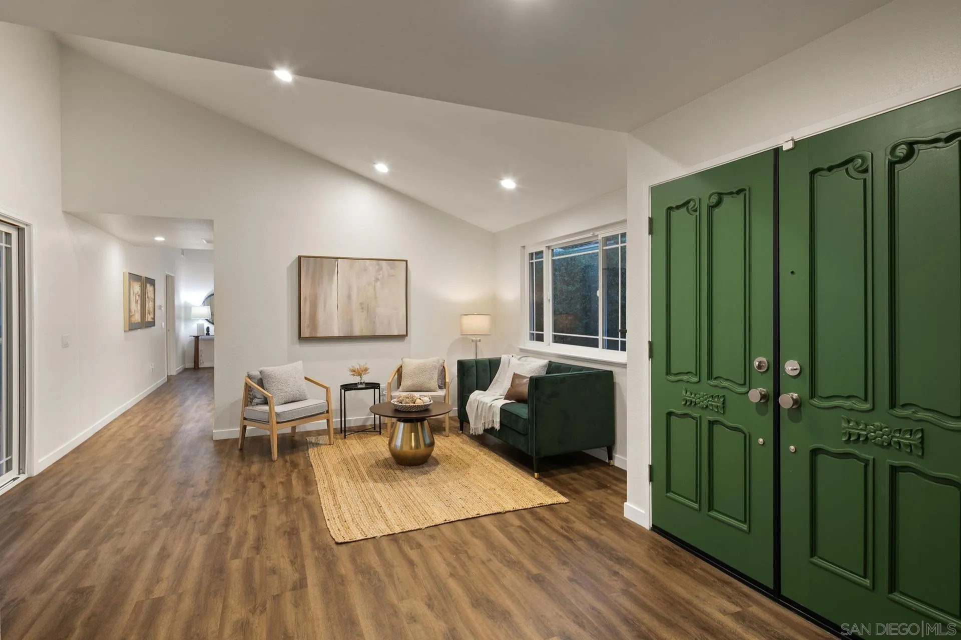 1736 Hill Top Lane Encinitas, CA 92024 - Photo 6 of 63 a living room with lots of furniture and a wooden floor