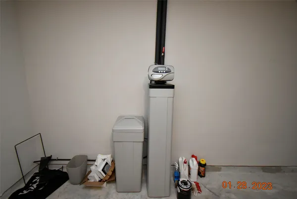 a view of storage and utility room with a window