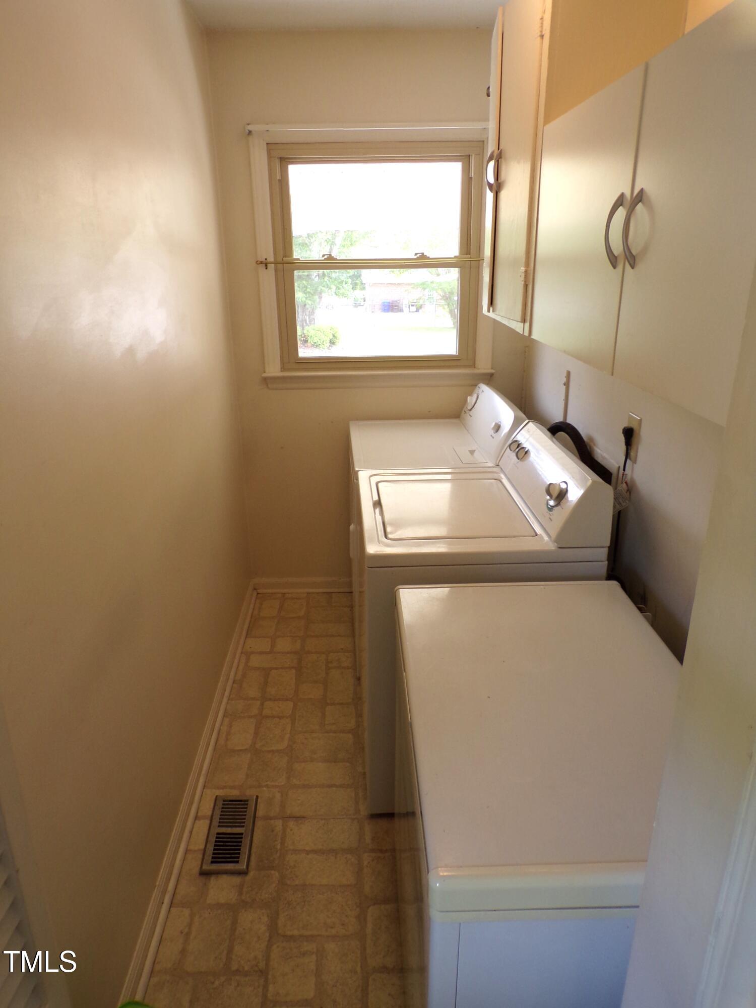 4908 Mandel Road Durham, NC 27712 - Photo 15 of 31 a utility room with dryer and washer