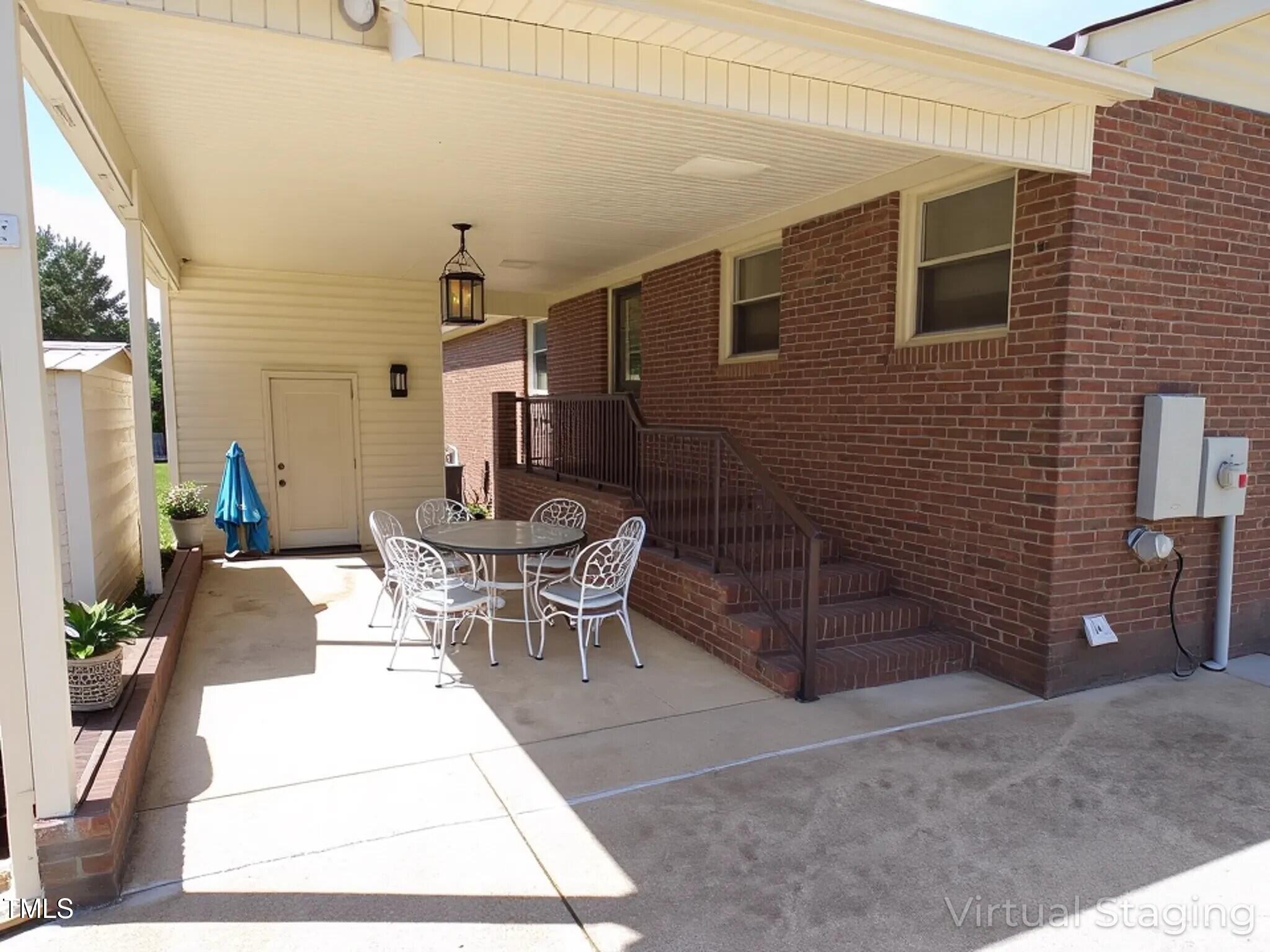 4908 Mandel Road Durham, NC 27712 - Photo 18 of 31 a dining room with furniture and wooden floor