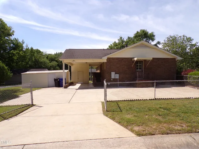 a house view with a garden space