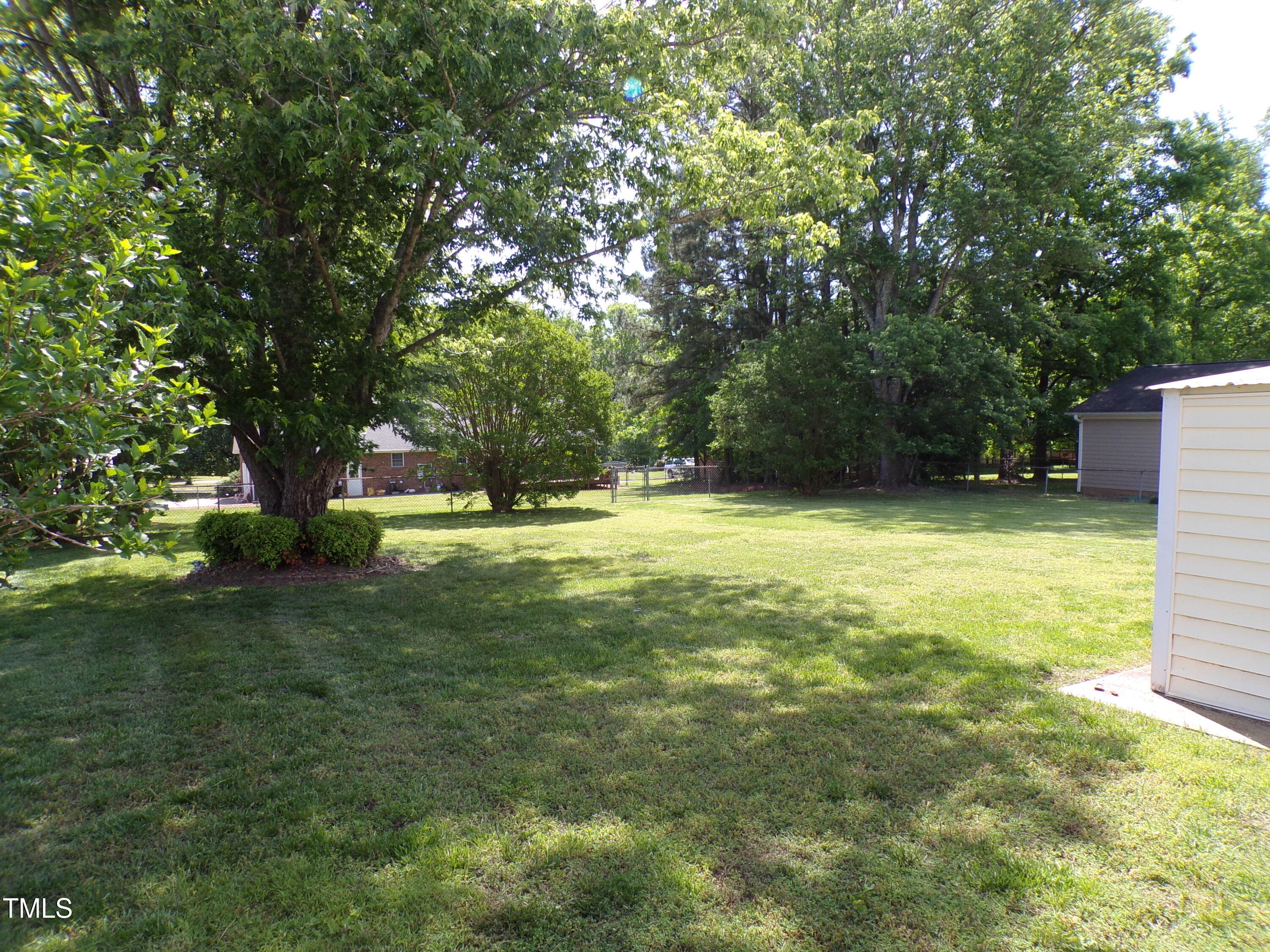4908 Mandel Road Durham, NC 27712 - Photo 22 of 31 a view of outdoor space with trees all around