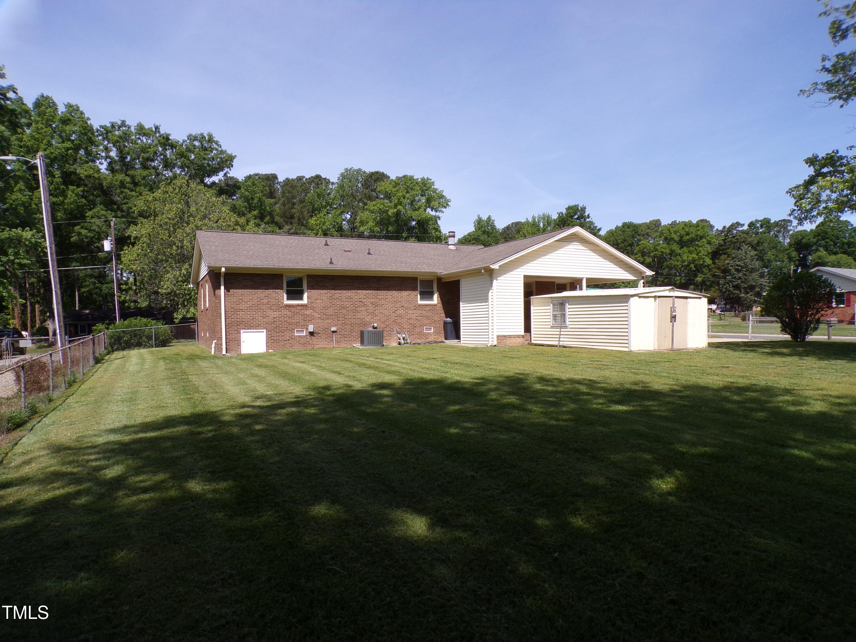 4908 Mandel Road Durham, NC 27712 - Photo 23 of 31 a front view of a house with a yard