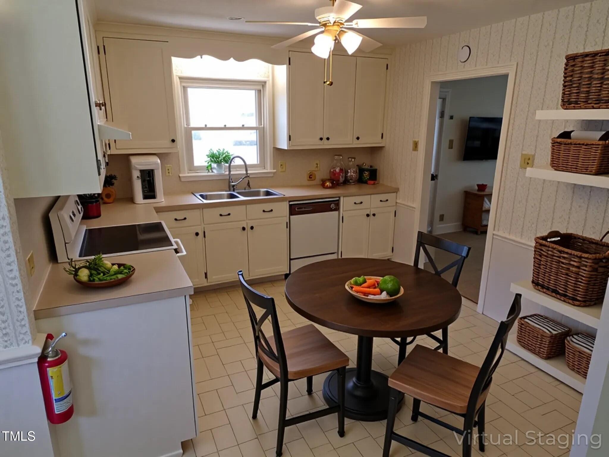 4908 Mandel Road Durham, NC 27712 - Photo 3 of 31 a kitchen with a dining table and chairs