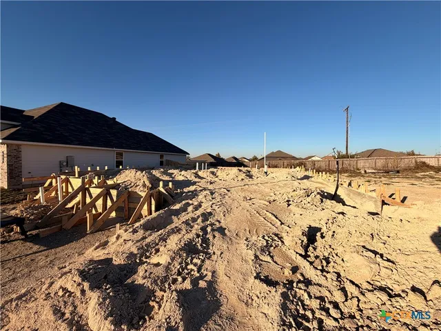 a view of a backyard of the house