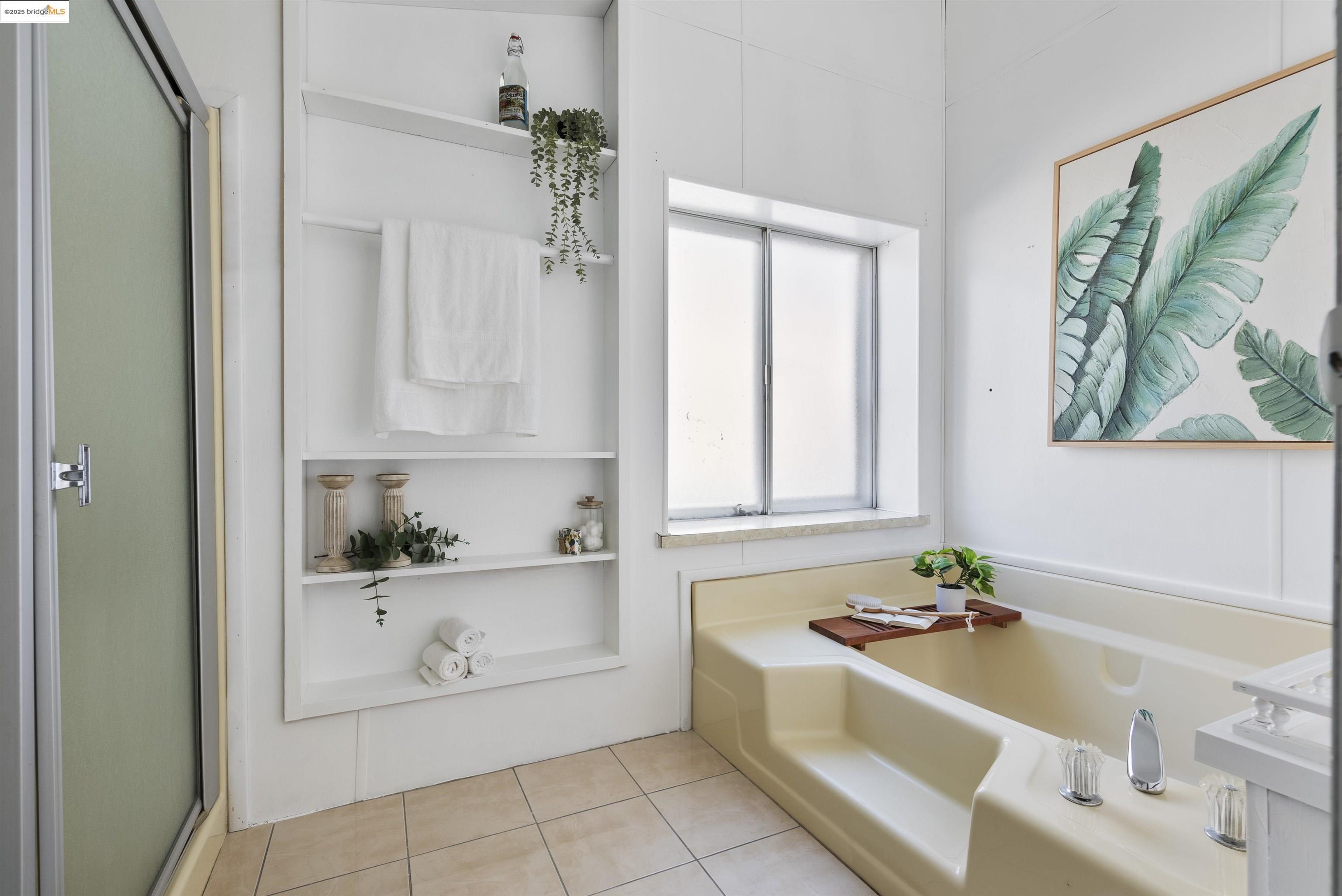 3215 Knob Street Nice, CA 95464 - Photo 17 of 35 a bathroom with a tub a sink and a window