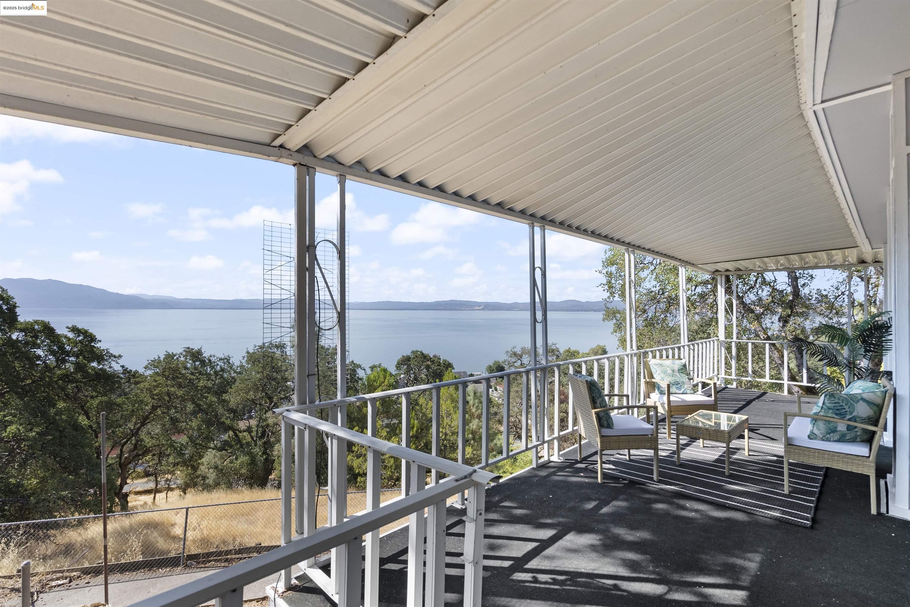 3215 Knob Street Nice, CA 95464 - Photo 22 of 35 a view of a chairs and table in the balcony