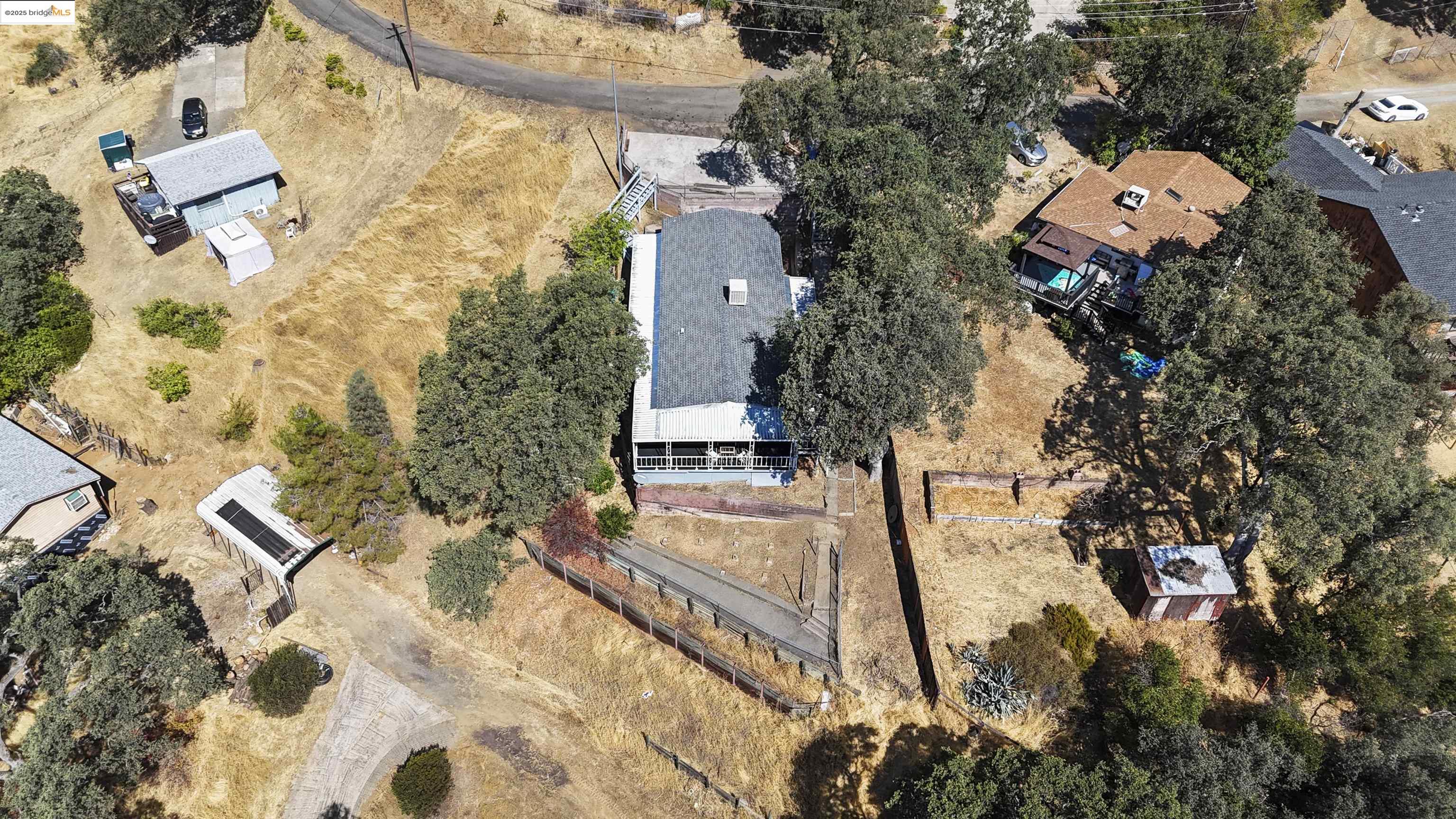 3215 Knob Street Nice, CA 95464 - Photo 28 of 35 aerial view of a house with swimming pool and large trees