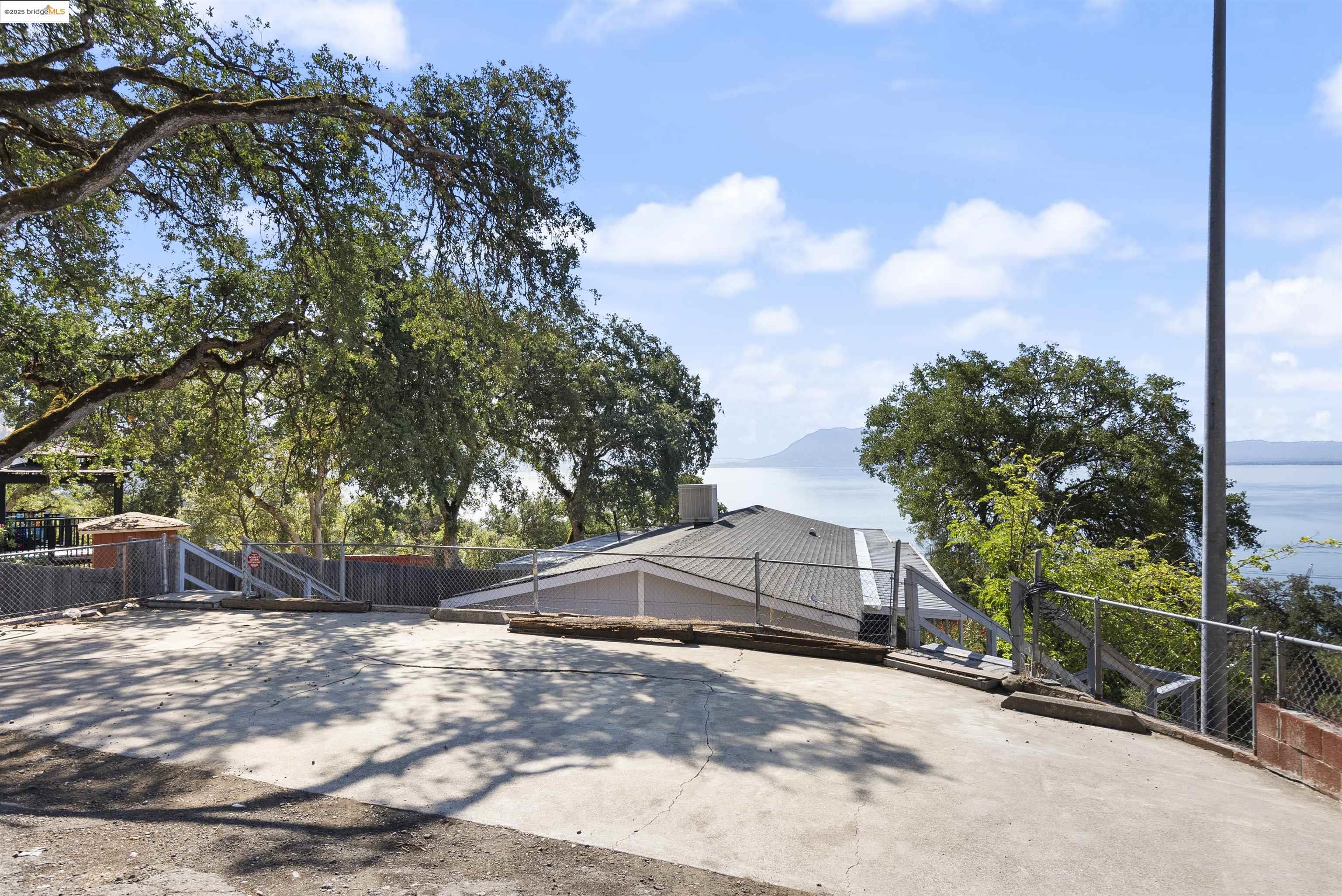 3215 Knob Street Nice, CA 95464 - Photo 29 of 35 a view of a house with a tree and a yard