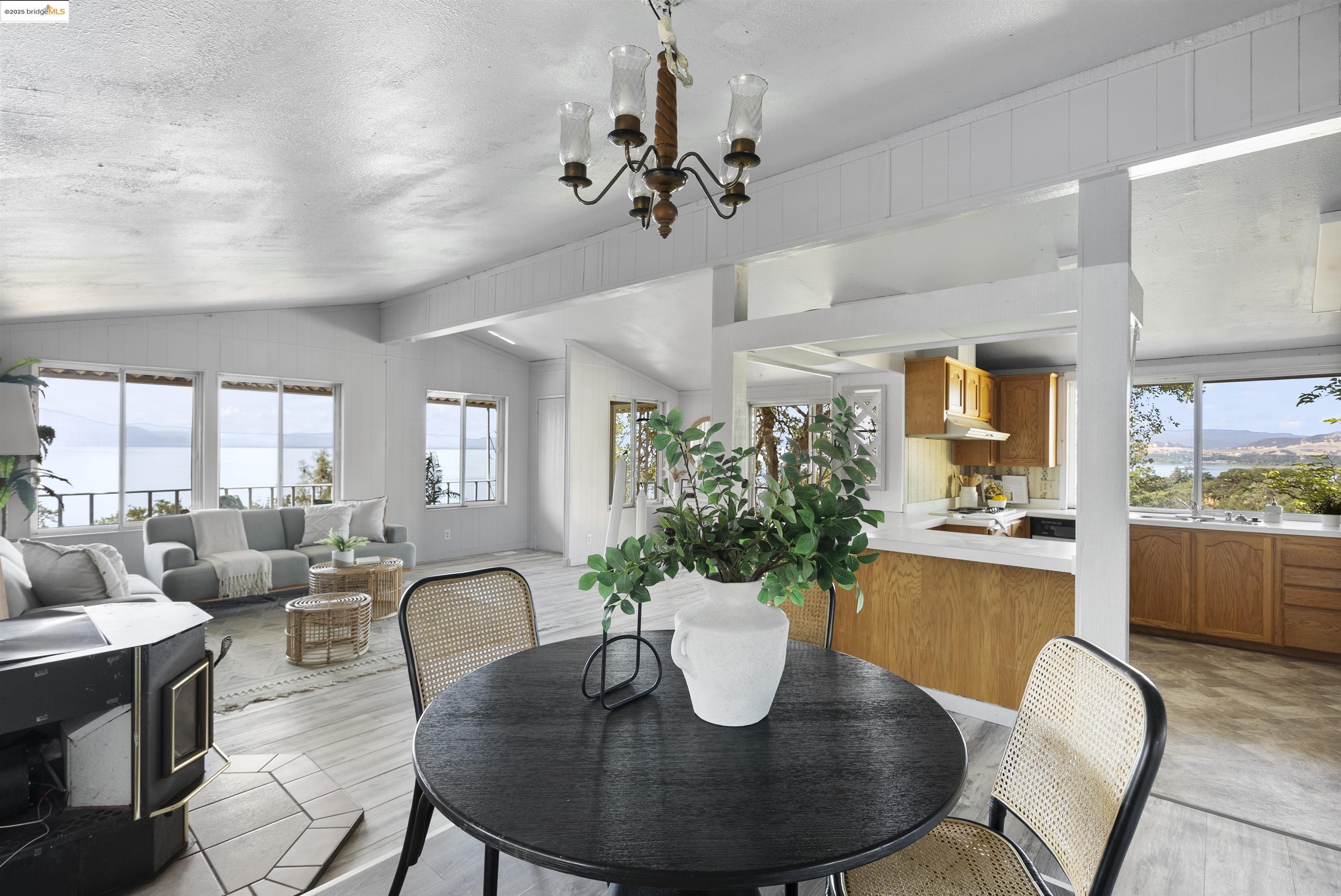 3215 Knob Street Nice, CA 95464 - Photo 5 of 35 a dining room with furniture a chandelier and wooden floor