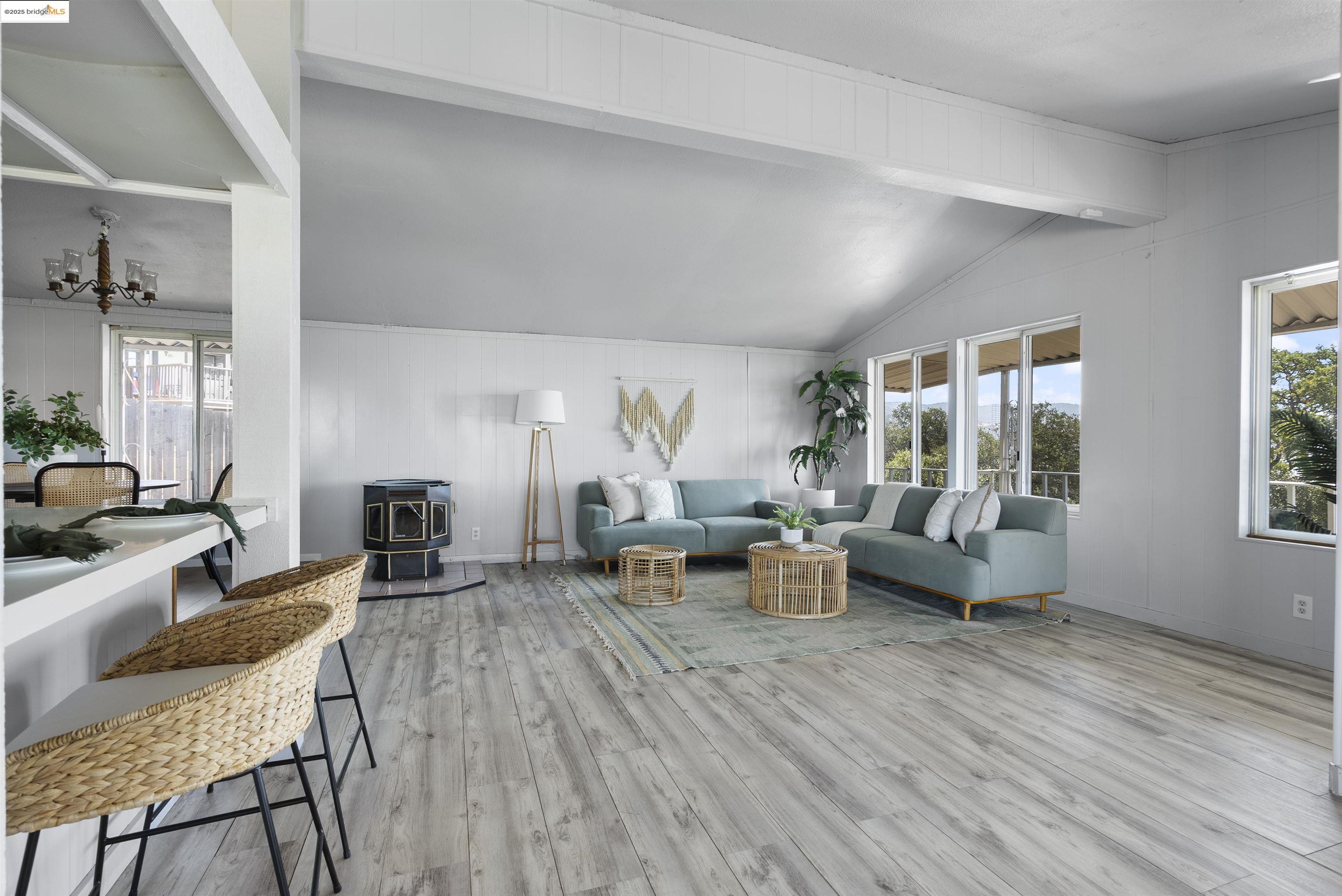 3215 Knob Street Nice, CA 95464 - Photo 6 of 35 a living room with fireplace furniture and a wooden floor