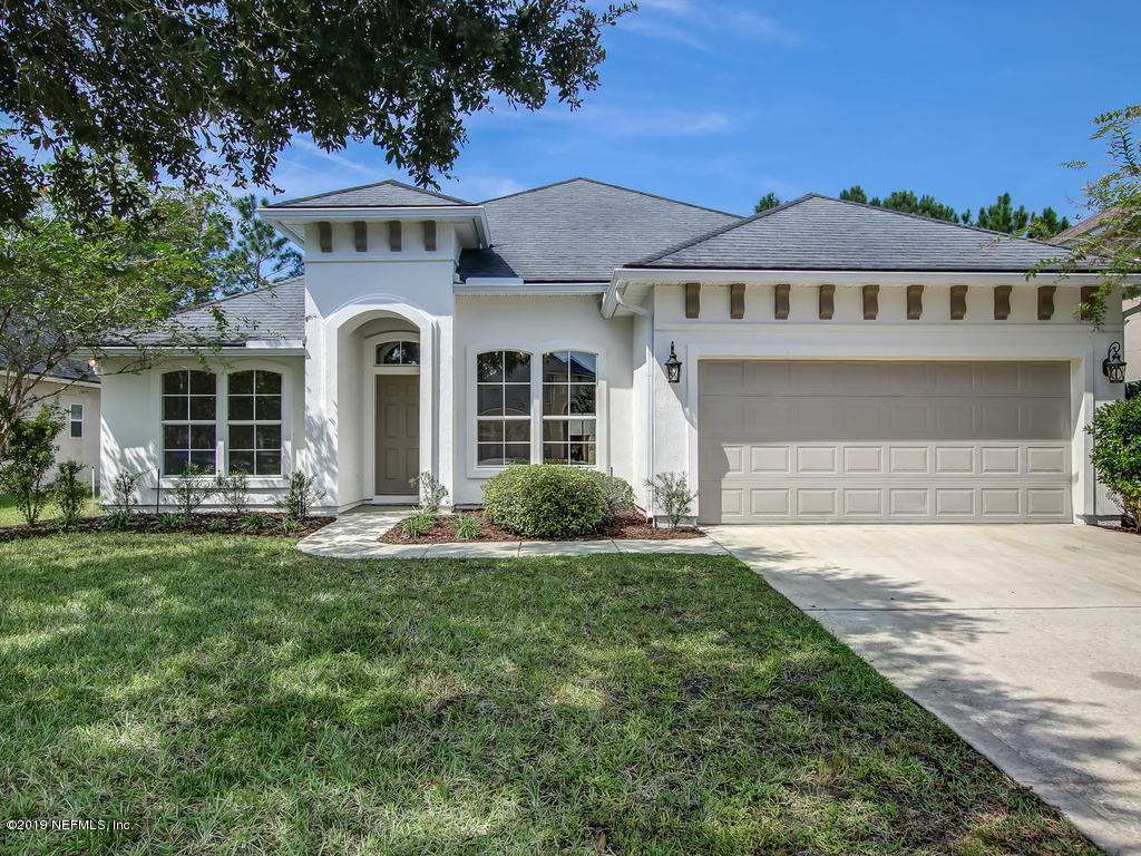 648 Porta Rosa Circle St. Augustine, FL 32092 - Photo 1 of 59 a front view of a house with a yard