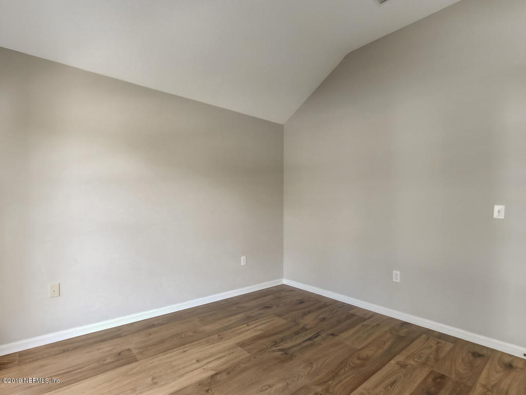 648 Porta Rosa Circle St. Augustine, FL 32092 - Photo 11 of 59 a view of an empty room with wooden floor