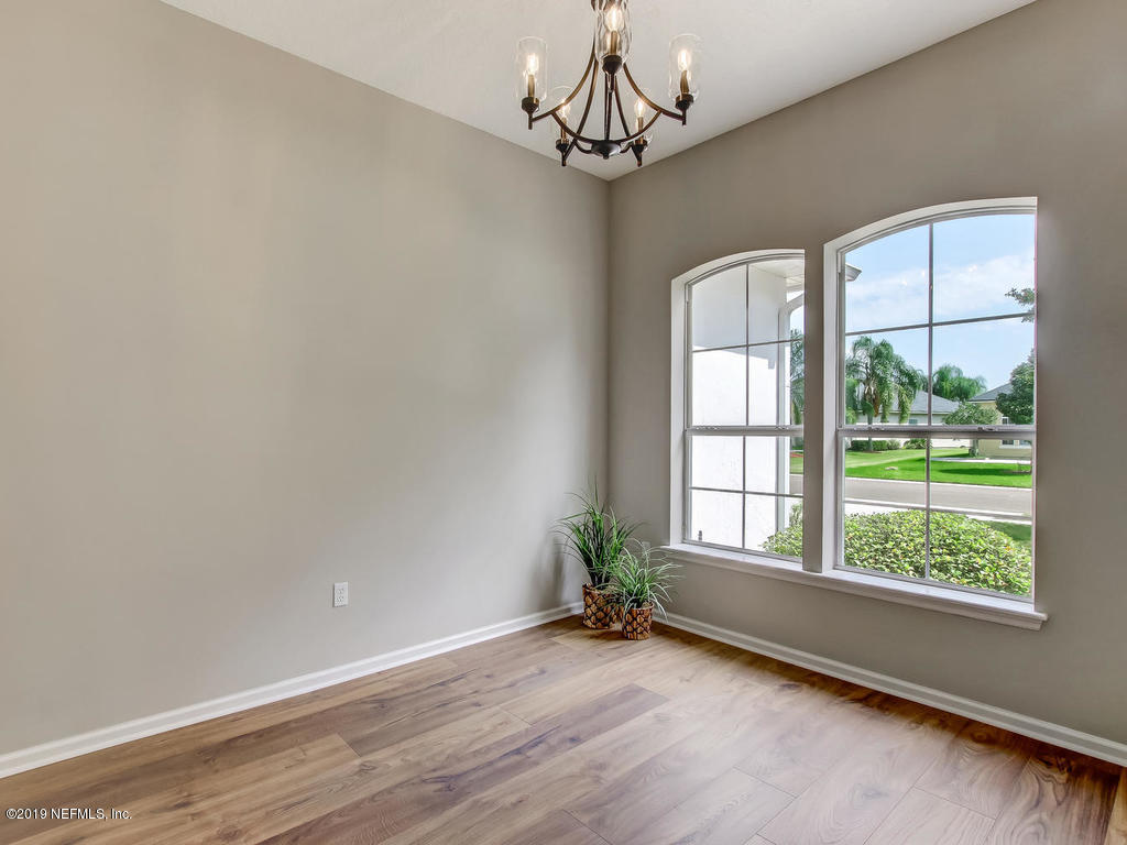 648 Porta Rosa Circle St. Augustine, FL 32092 - Photo 12 of 59 a view of a livingroom with a window and wooden floor