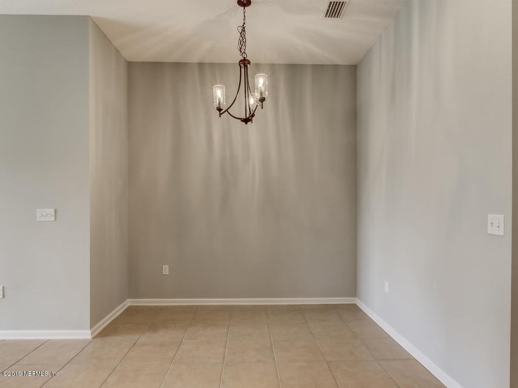 648 Porta Rosa Circle St. Augustine, FL 32092 - Photo 23 of 59 a view of an empty room with a chandelier fan