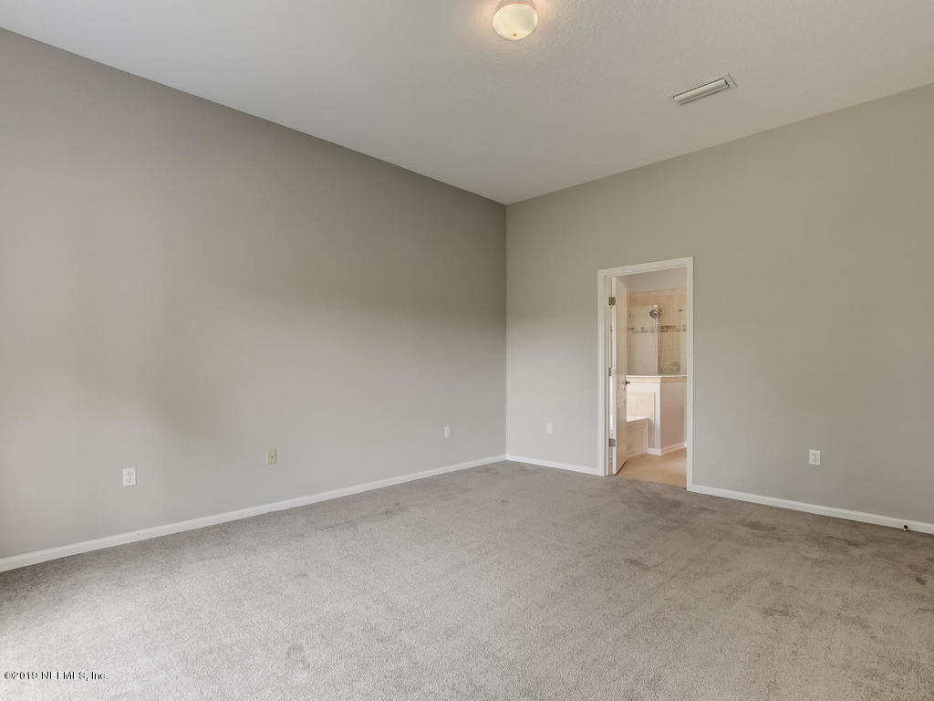 648 Porta Rosa Circle St. Augustine, FL 32092 - Photo 30 of 59 a view of an empty room and a window